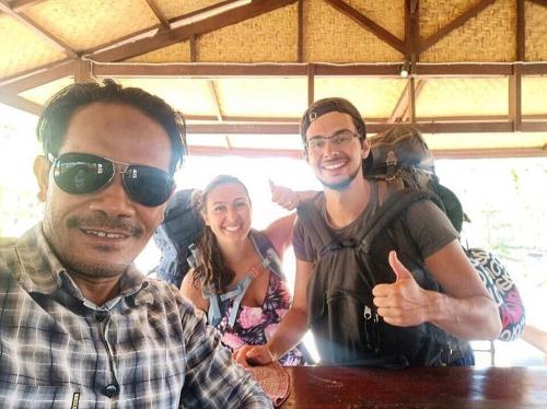 a group of three people posing for a picture at AMIGOS BUNGALOWS GILI MENO in Gili Meno
