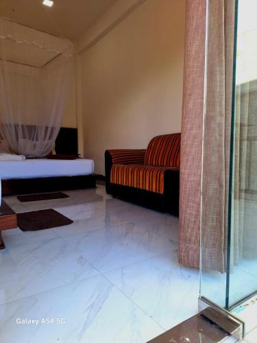 Ένα ή περισσότερα κρεβάτια σε δωμάτιο στο Ella Odyssey Inn