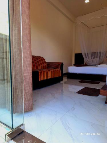 Ένα ή περισσότερα κρεβάτια σε δωμάτιο στο Ella Odyssey Inn