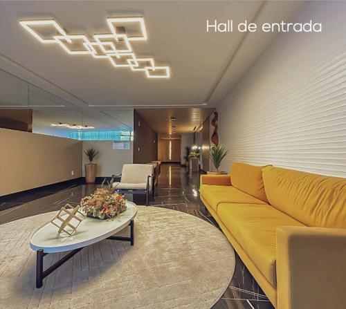 Et opholdsområde på Apartamento vista para o mar