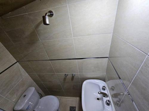 a bathroom with a toilet and a sink at Mono ambiente a estrenar in Las Heras