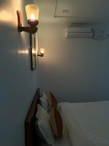 a hotel room with a bed with a lamp and a heater at Jawai Empire Resort by Premier Hotels in Pāli
