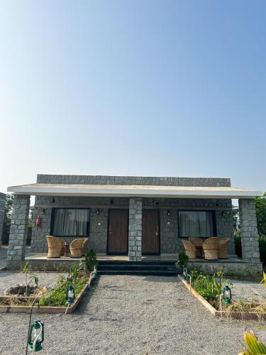 a building with a bunch of pillows in front of it at Jawai Empire Resort by Premier Hotels in Pāli