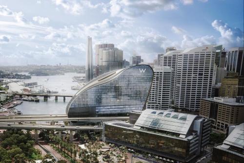 a view of a city with a bridge and buildings at PRIME SPOT: Modern Studio+Balcony Darling Harbour in Sydney