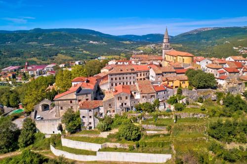 a town on a hill with a church at Villa Lapis in Buzet