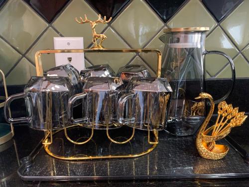 a group of glass containers sitting on a shelf at Angel 3 in Victoria