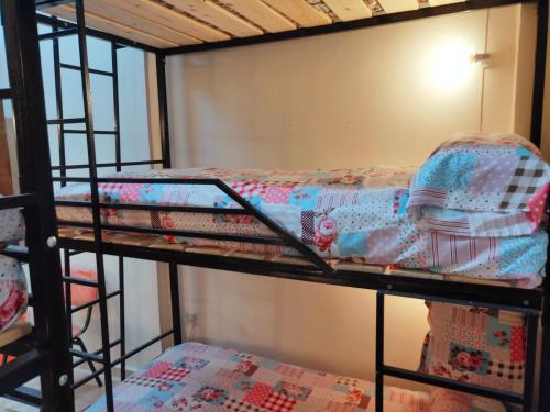 a couple of bunk beds in a room at Youth Palace Hostel هوستل قصر الشباب in Alexandria