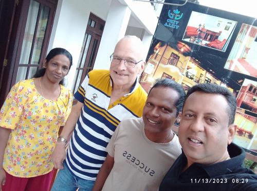 a group of three people posing for a picture at Vino Villa Tourists & Local Accommodations - 24 Hrs in Kandy
