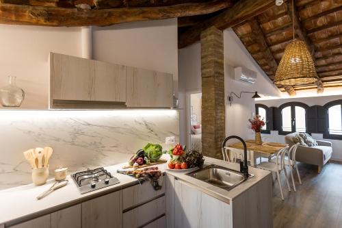 a kitchen with a sink and a counter top at L’Angorfa de Casa Santiago, casa rural in Tivenys
