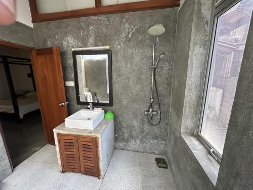 a bathroom with a sink and a shower at Mount Bliss Home Stay in Mount Lavinia