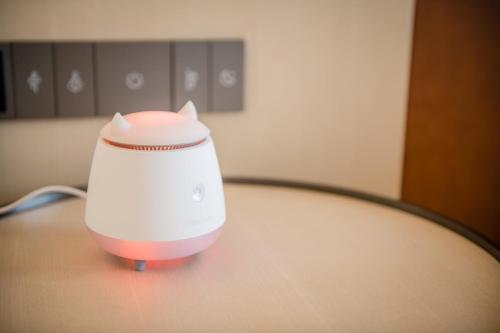 a white appliance sitting on top of a table at EVEN Hotel Nanjing Yangtze River by IHG in Nanjing