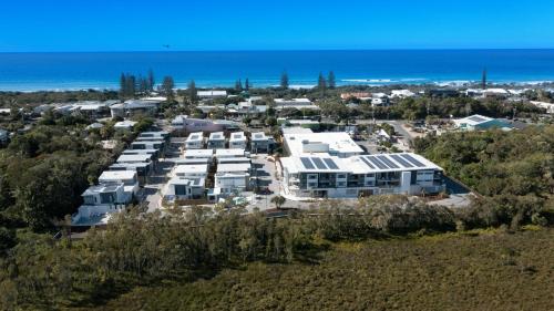 an aerial view of a resort with the ocean at Essence Peregian Beach Resort - Kamala 3 Bedroom Luxury Home in Peregian Beach