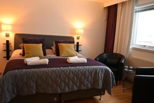 Postel nebo postele na pokoji v ubytování Hotell Lyktan