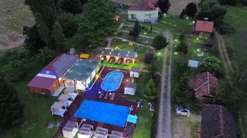 an aerial view of a house with a swimming pool at Brvnare Rodjak sa sela in Mionica