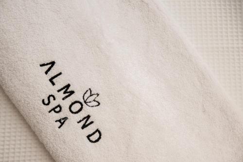 a napkin with the words happy new year written on it at Almond Hotel - Adults only in Neve Ilan