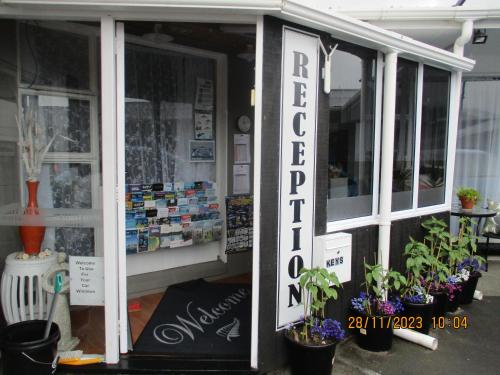 a flower shop with plants in the front of it at High Street Living Motel in Picton