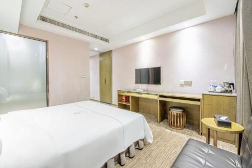 Μια τηλεόραση ή/και κέντρο ψυχαγωγίας στο lnsail Hotel Shenzhen Luohu Port Railway Station