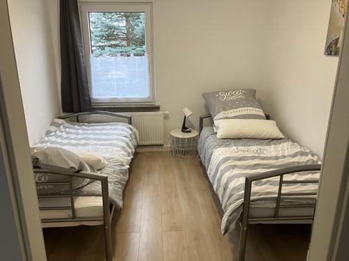 A bed or beds in a room at Borsch urlaub Ferienwohnungen