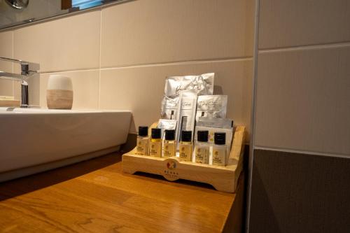 a bathroom with a sink and a shelf of toiletries at Renka Hotel & Spa in Göcek