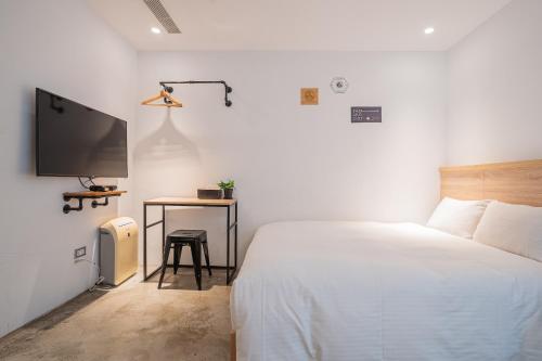 Ένα ή περισσότερα κρεβάτια σε δωμάτιο στο CHASE Hotel