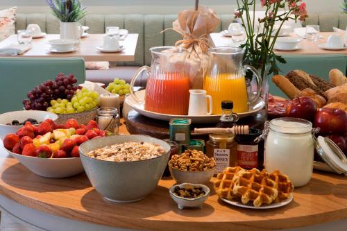 a table filled with different types of breakfast foods at The Charm Brighton Boutique Hotel & Spa in Brighton & Hove