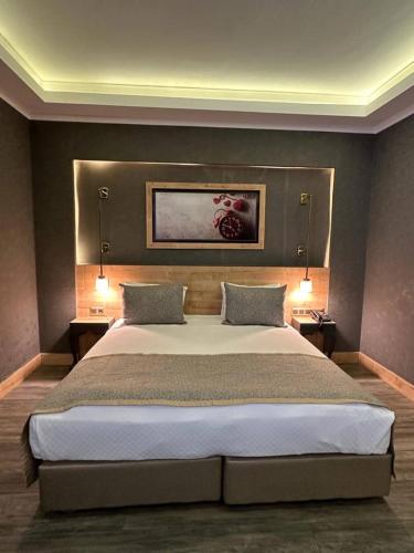 Postel nebo postele na pokoji v ubytování Hisarhan Otel