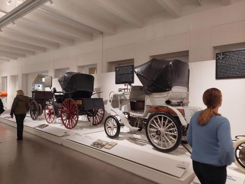 a group of antique cars on display in a museum at Pension Welserhof in Wilfersdorf