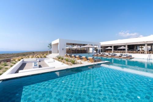 an image of a swimming pool at a resort at KOIA All - Suite Well Being Resort - Adults Only in Agios Fokas