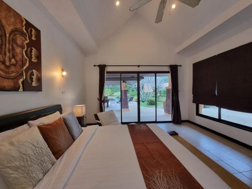 Cama o camas de una habitación en Baan Zoe Villa