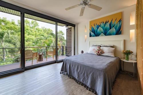 a bedroom with a bed and a balcony at 2056 - Mixie 203 in Santa Cruz Huatulco