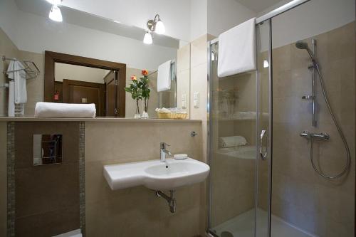 a bathroom with a sink and a shower at Pałac Polanka in Krosno