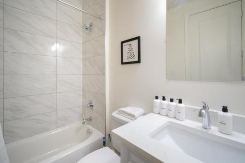 a bathroom with a sink and a toilet and a shower at Dupont Circle 1br w wd nr metro station WDC-747 in Washington, D.C.