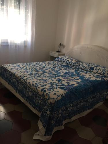 Ένα ή περισσότερα κρεβάτια σε δωμάτιο στο A pochi passi dal mare by PortofinoVacanze