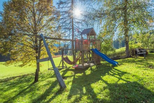 a playground in a park with a slide at Wald am See in Kitzbühel