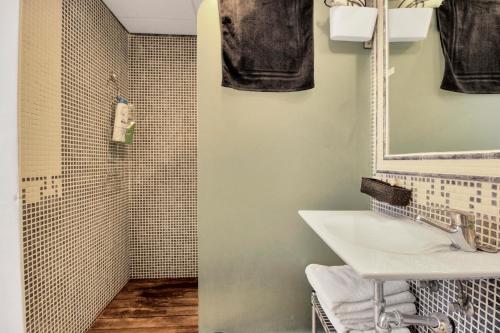 a bathroom with a sink and a shower at GAV La Ermita in Ronda