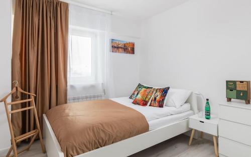 Кровать или кровати в номере Rent like home - Smocza 26