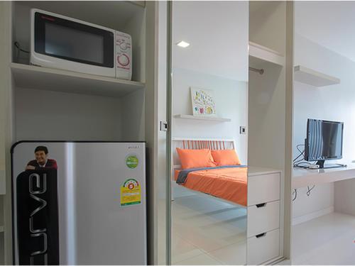 Una cama o camas en una habitación de Peaberry Place - พีเบอร์รี่เพลส