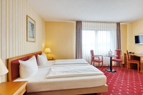 Postel nebo postele na pokoji v ubytování Akzent Aktiv & Vital Hotel Thüringen