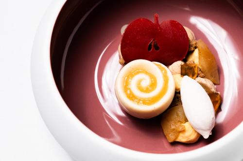 a plate of food with an egg and an apple at Grand Hotel Majestic gia' Baglioni in Bologna