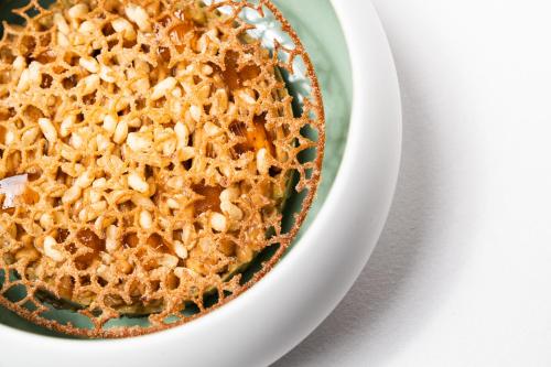 a bowl of food on a plate on a table at Grand Hotel Majestic gia' Baglioni in Bologna
