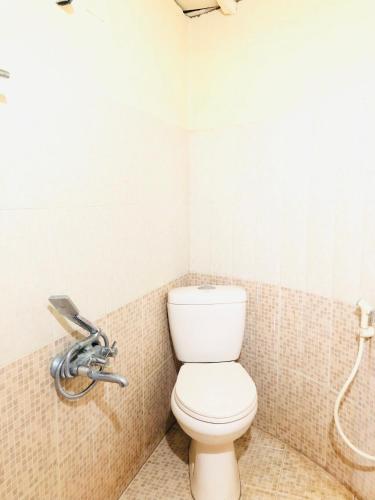 a bathroom with a toilet and a shower at Punarjani Ayurvedic Resorts in Ramakkalmedu