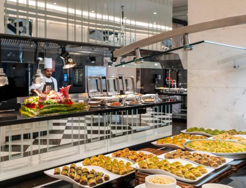 a buffet line with many different types of food at Kaya Palazzo Resort & Casino in Kérynia