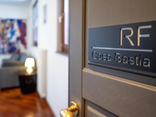 a close up of a door with a sign that reads casa basilla at Bastia RF Balcony up to 3 guests - Scalo Romana Olimpico Prada Bocconi IEO IED Forum DUOMO15min in Milan