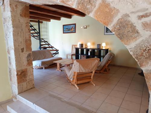 a living room with a table and chairs at Villa Arismari - Kokkino Chorio in Chania Town