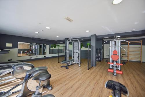 a gym with several cardio equipment in a room at Hotel Florida Magaluf - Adults Only in Magaluf