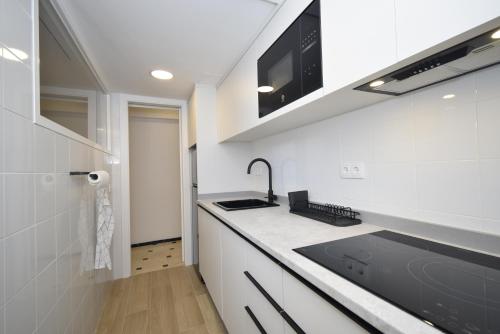 Kuchyň nebo kuchyňský kout v ubytování Pdo. Mediterráneo - Fincas Arena