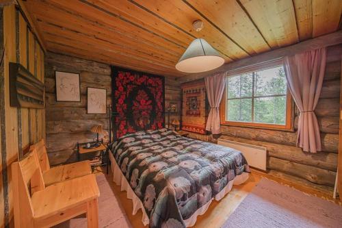 Ένα ή περισσότερα κρεβάτια σε δωμάτιο στο Lapland Cabin Levi