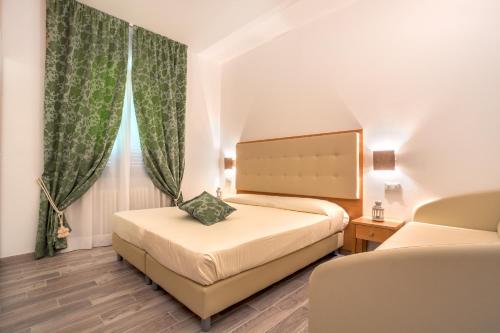 Postel nebo postele na pokoji v ubytování Hotel Il Buongustaio