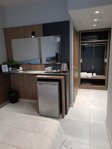 a kitchen with a sink and a dishwasher at Elizabeth Queen Luxury Rooms in Paralia Katerinis