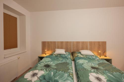Postel nebo postele na pokoji v ubytování Apartmán Claudia - Rezidence K Lanovce